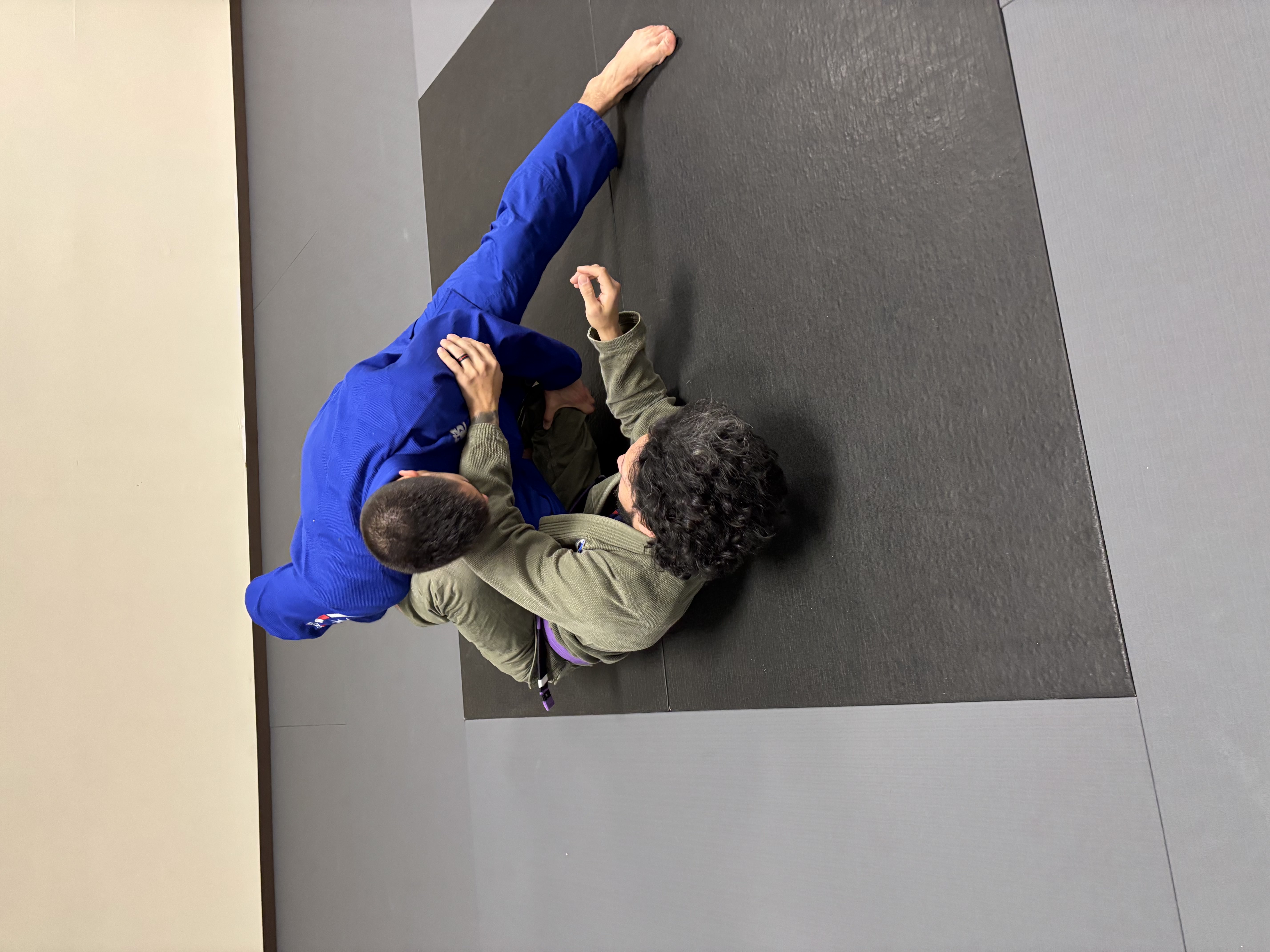 Adult Gi class drilling from above at ZEN BJJ