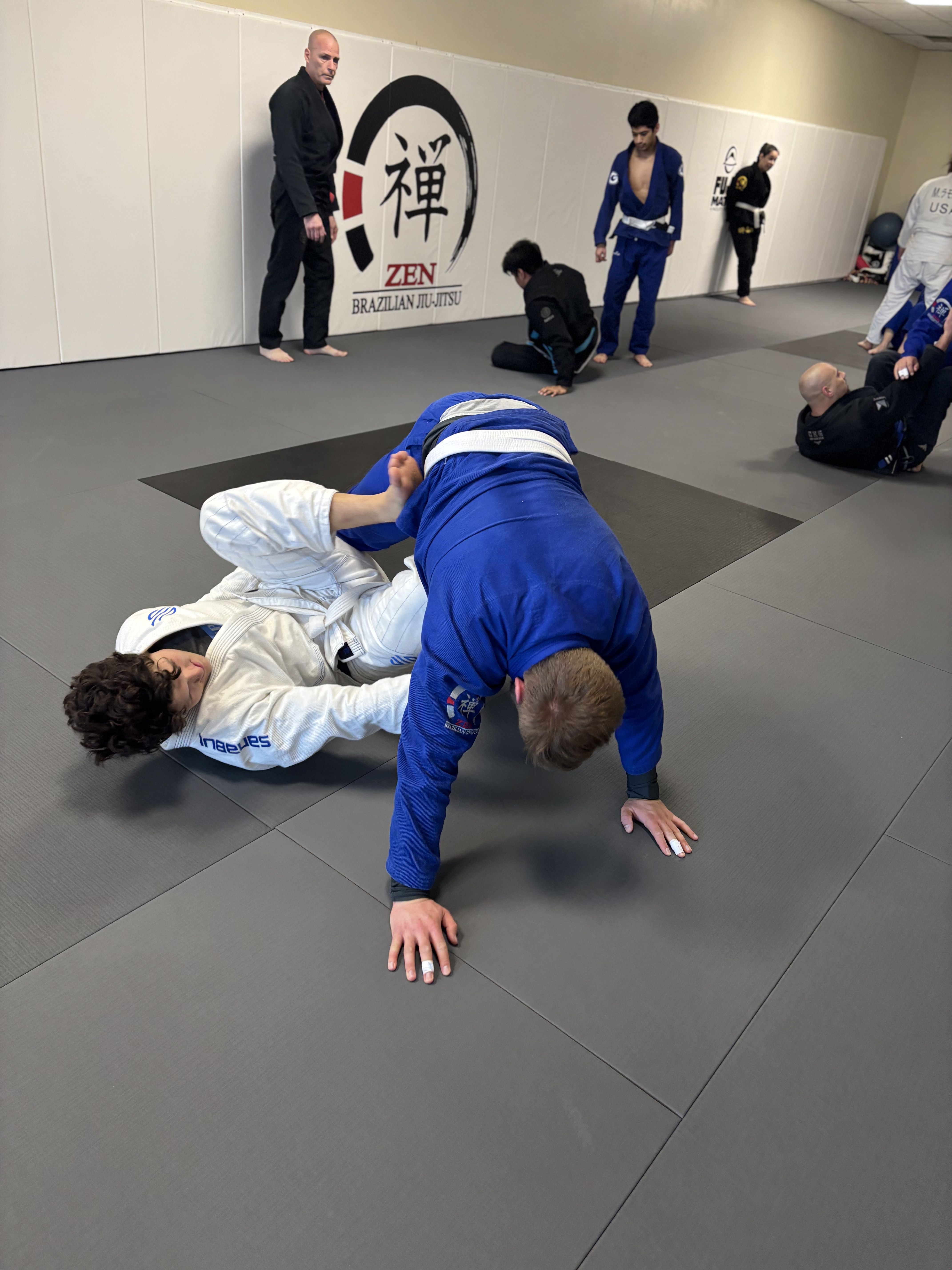 Students training Brazilian Jiu-Jitsu on the mats at ZEN in Coopersburg, PA