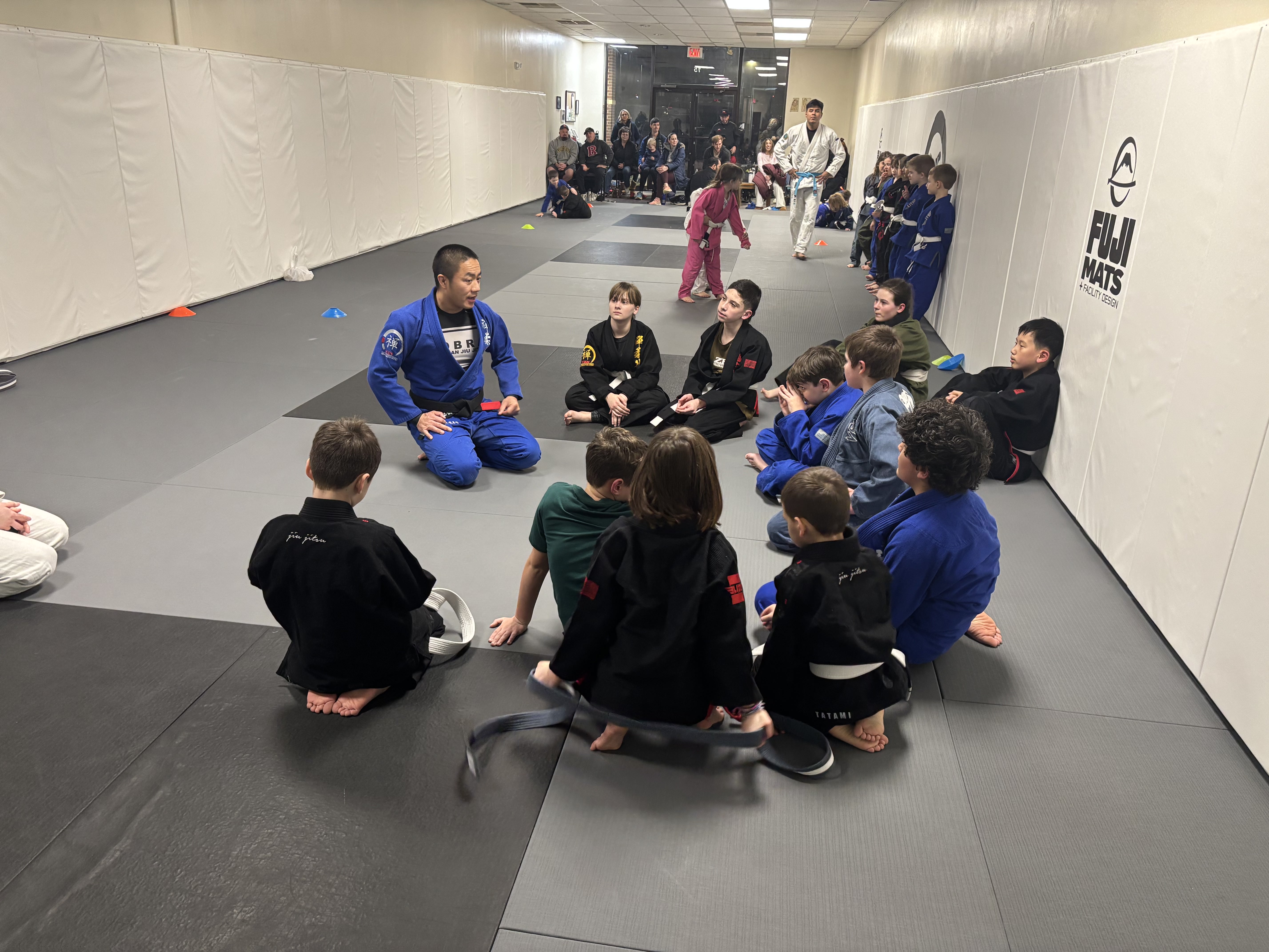 Kids class with coach and students at ZEN Brazilian Jiu-Jitsu